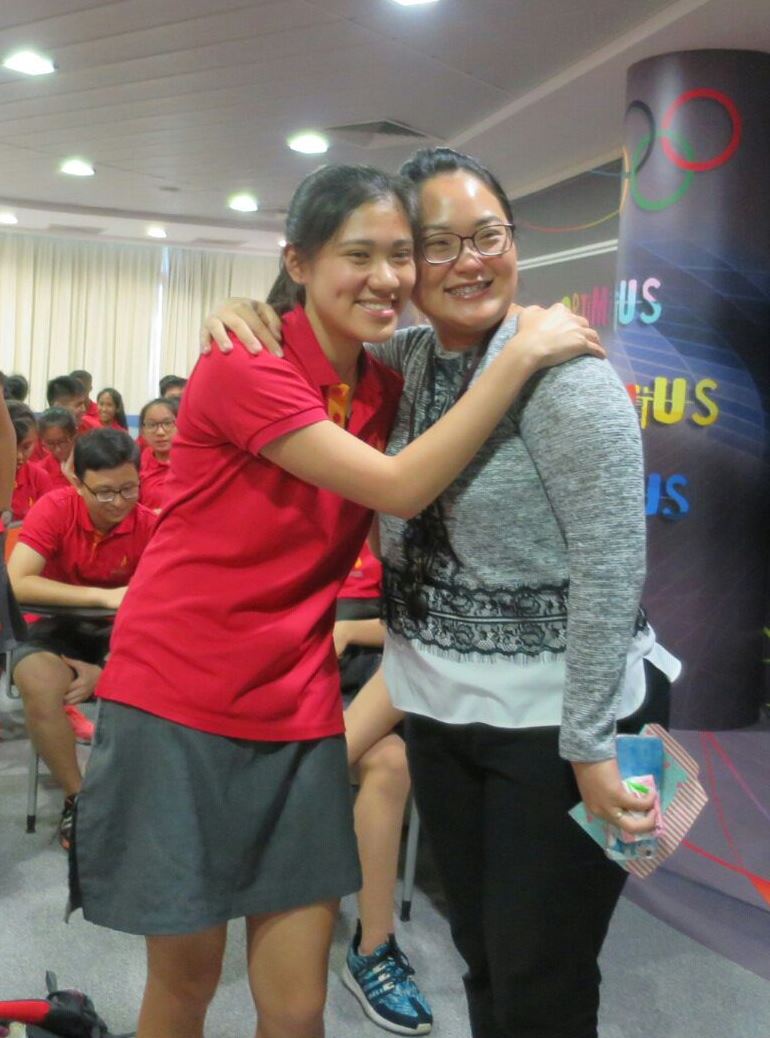 2 Top scorer Sabrina Chau Shu Ning with Chinese Language teacher Oh Hui Min.jpg